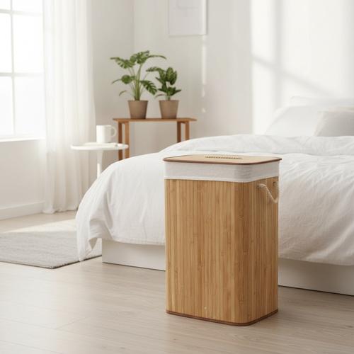Bamboo laundry basket with lid in a bright minimalist bedroom with white linen